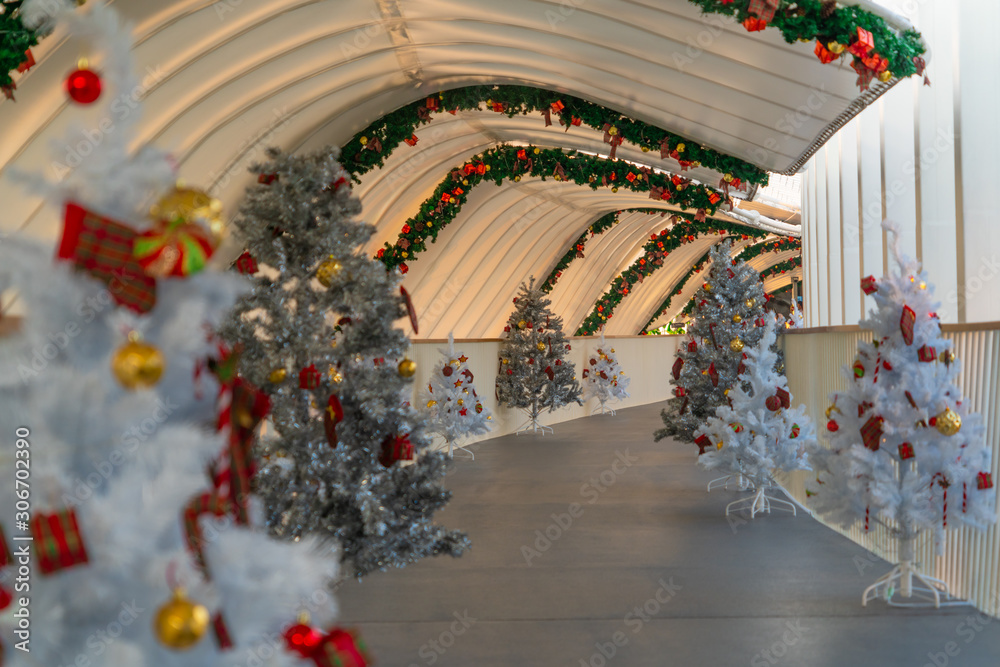 Christmas tree decoration along walkway in city center in Christmas festival of December 2019.