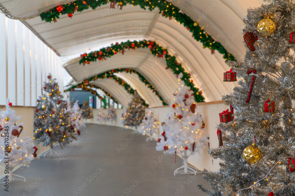 Christmas tree decoration along walkway in city center in Christmas festival of December 2019.