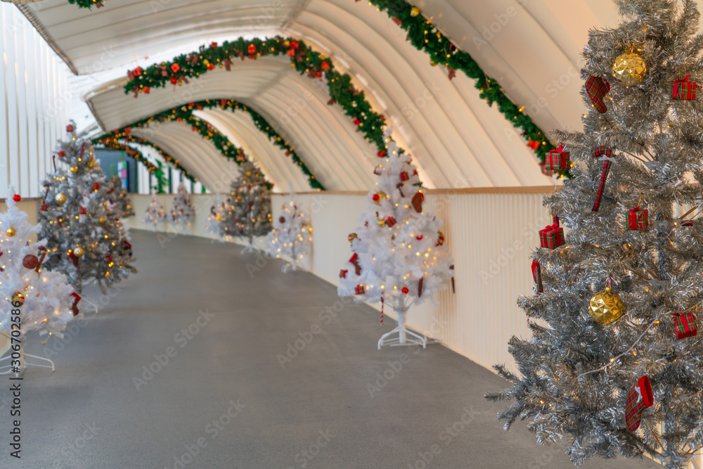 Christmas tree decoration along walkway in city center in Christmas festival of December 2019.