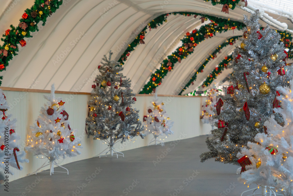 Christmas tree decoration along walkway in city center in Christmas festival of December 2019.