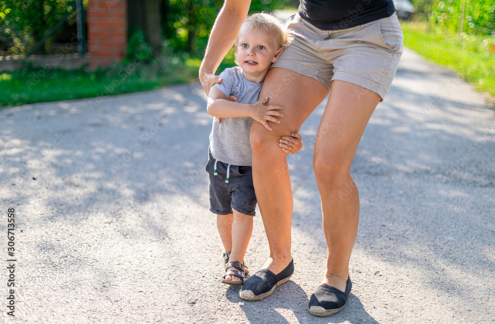 Happy family spending time together walking outdoor at sunny summer day