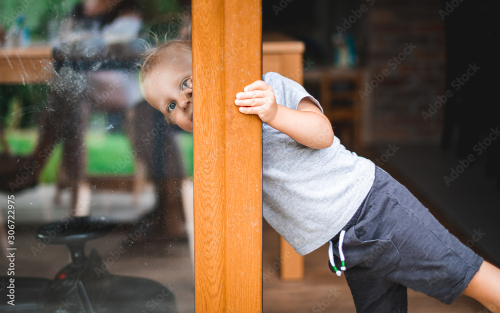 Portrait of little boy during playing on home patio