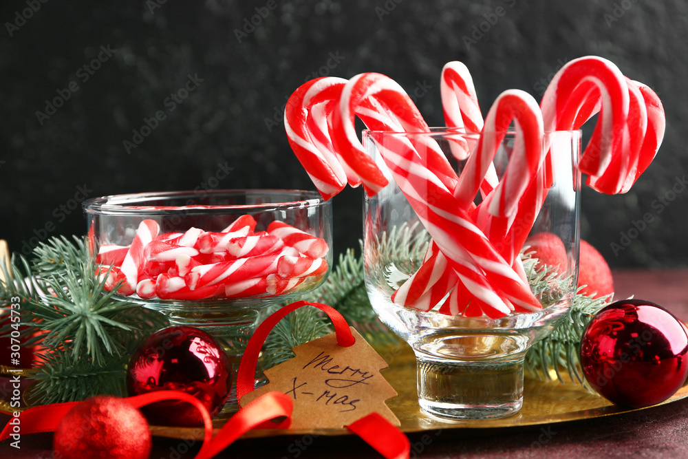 Composition with Christmas candy canes on table