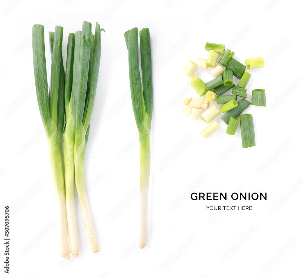 Creative layout made of green onion. Flat lay. Food concept. Green onion on white background.