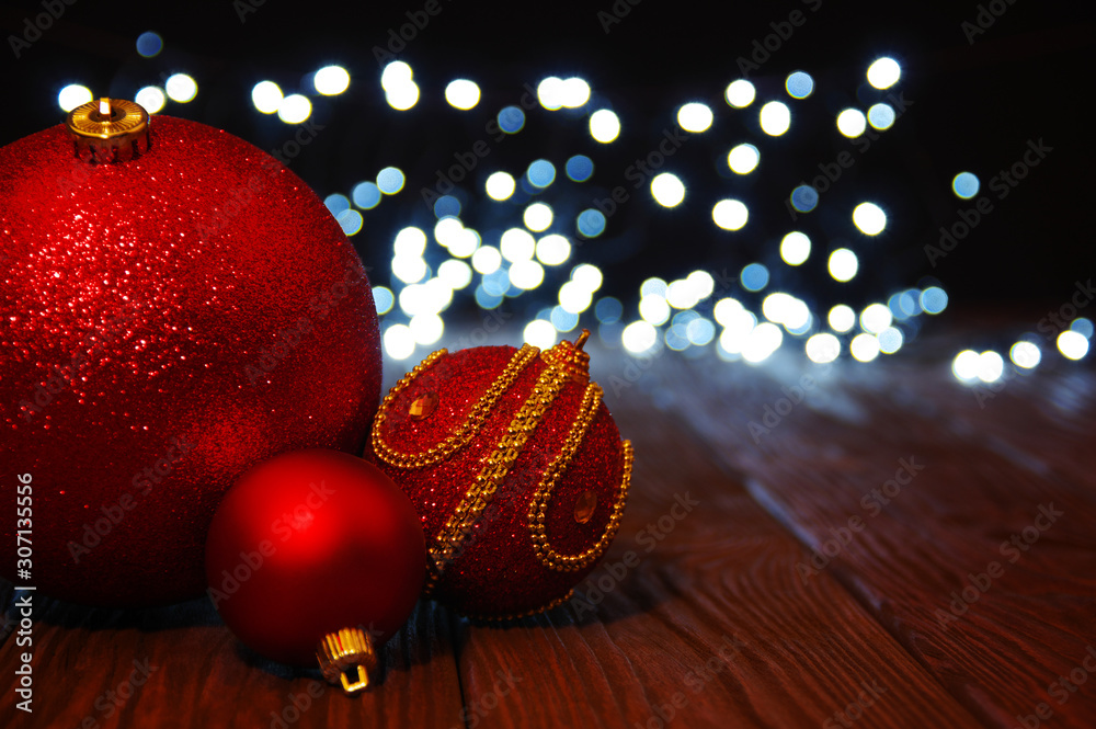 Red Christmas balls on a wood