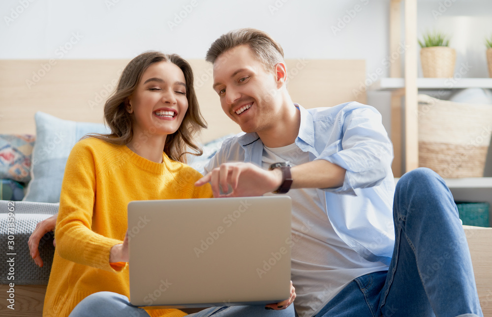 couple is using a laptop