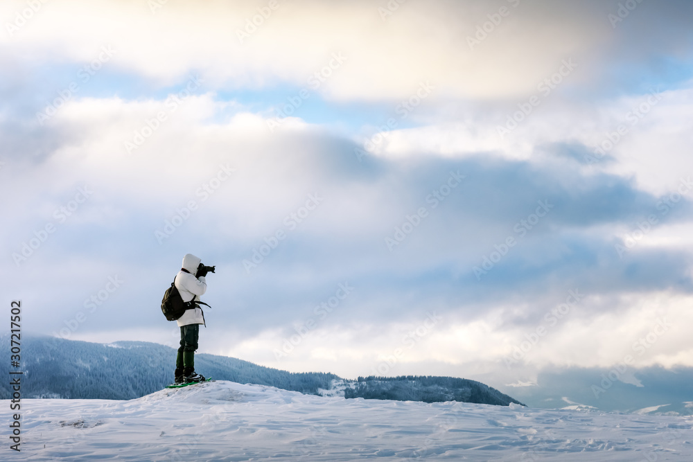 Alone photographer with a backpack