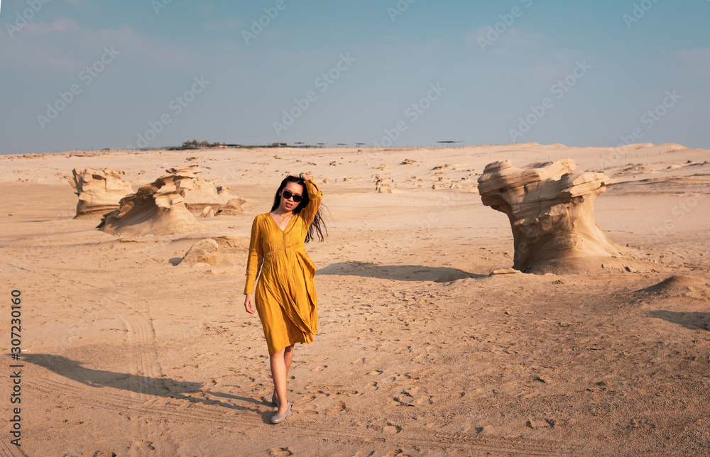 Female traveler visiting Fossil dunes in Abu Dhabi UAE