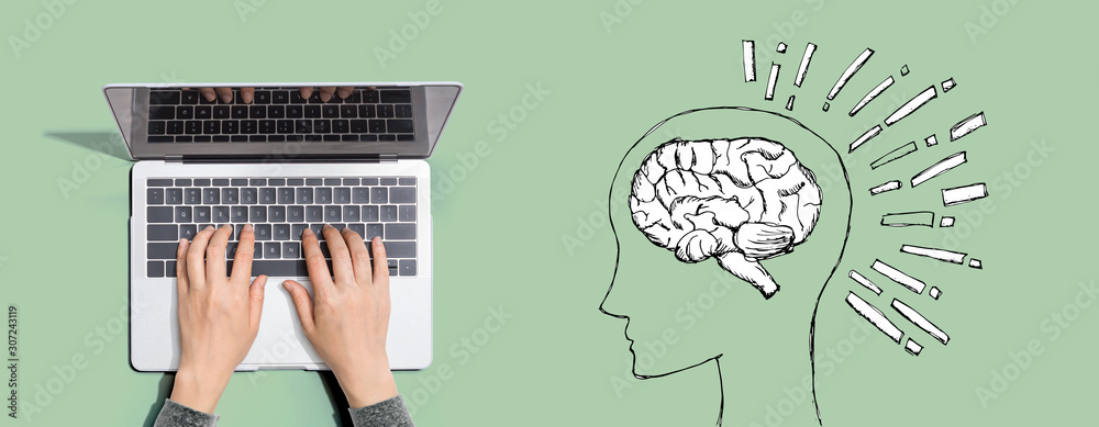 Brain illustration with person using a laptop computer