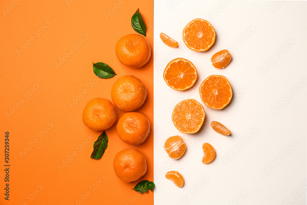 Sweet tangerines on color background