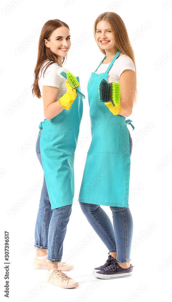 Female janitors on white background