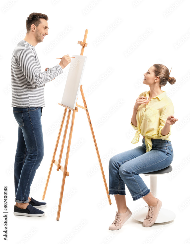 Young woman posing for artist on white background