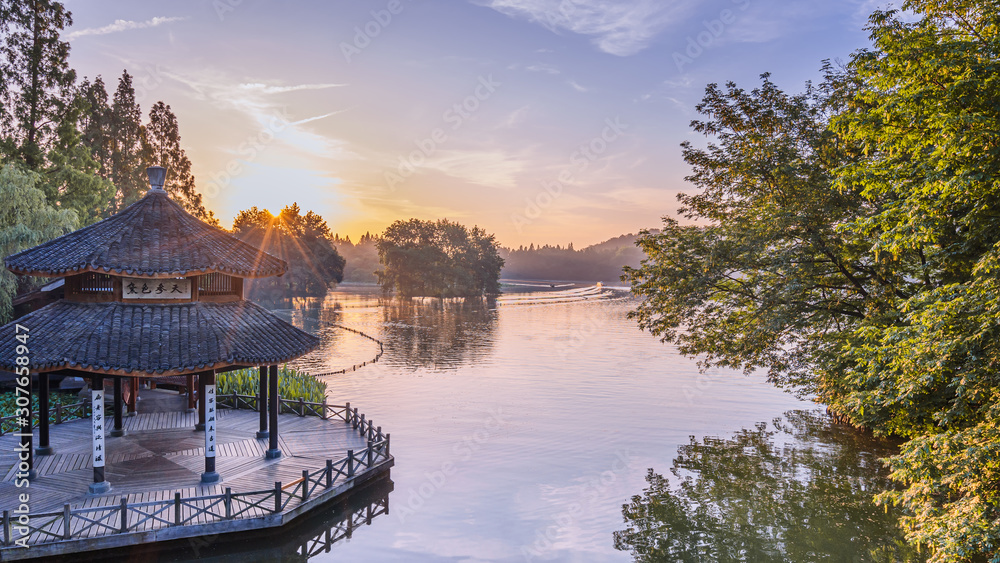 A pavilion during sunrise in West Lake in Hangzhou, Zhejiang province，China with all Chinese words o