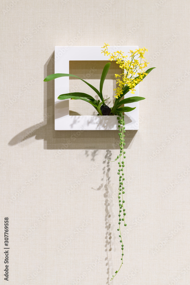 flower arrangement on the wall