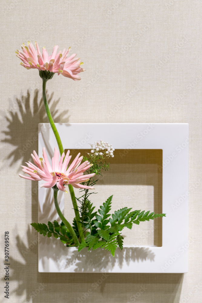 flower arrangement on the wall