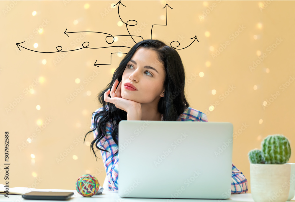 Idea arrows with young woman using a laptop