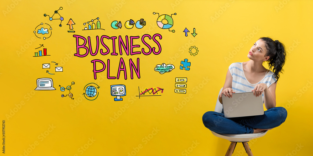 Business plan with young woman using a laptop computer