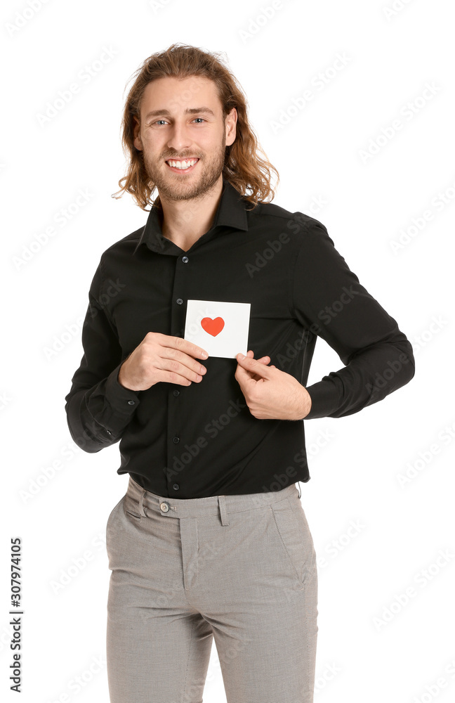 Handsome man with greeting card on white background. Valentines Day celebration