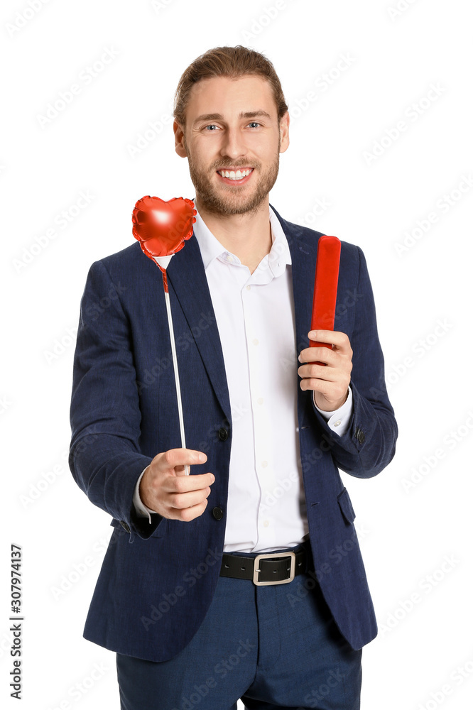 Handsome man with heart and gift on white background. Valentines Day celebration