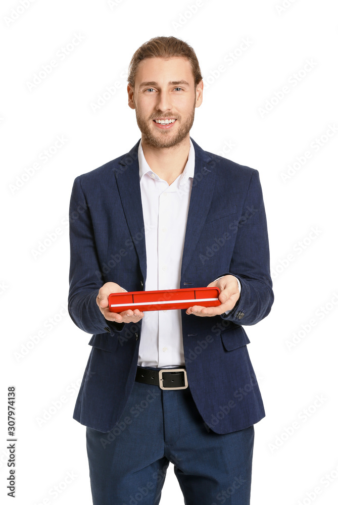 Handsome man with gift on white background. Valentines Day celebration