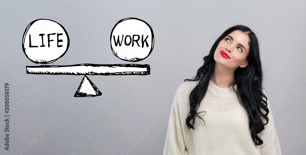 Life and work balance with happy young woman on a gray background