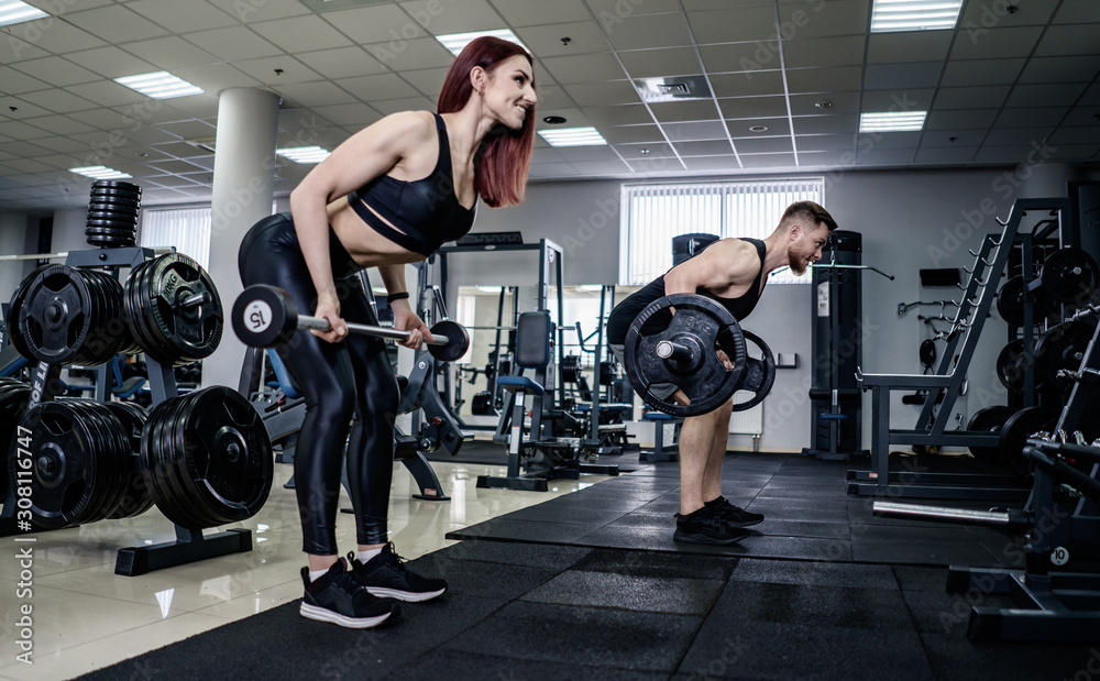 Slim brunette woman doing squats with barbell in fitness hall, sport concept, fit model, sport gym b