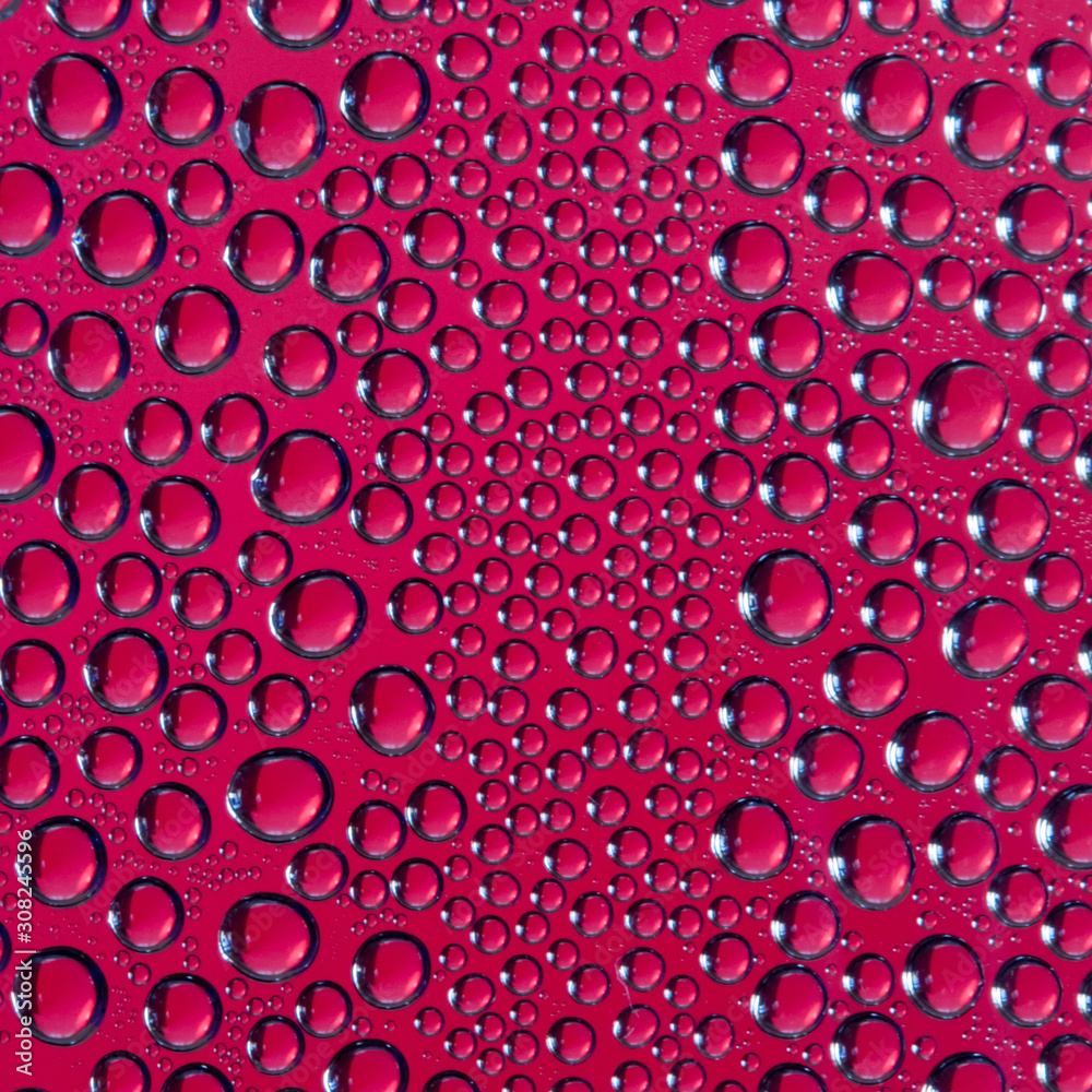 Waterdrops on red background