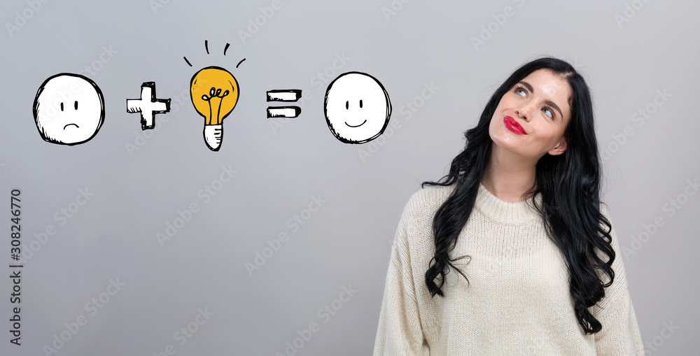 Good idea equals happy with happy young woman on a gray background