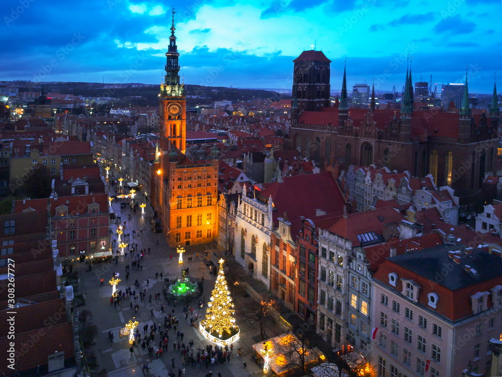 Aerial view of the old town in Gdansk with beautiful christmas tree at dusk, Poland