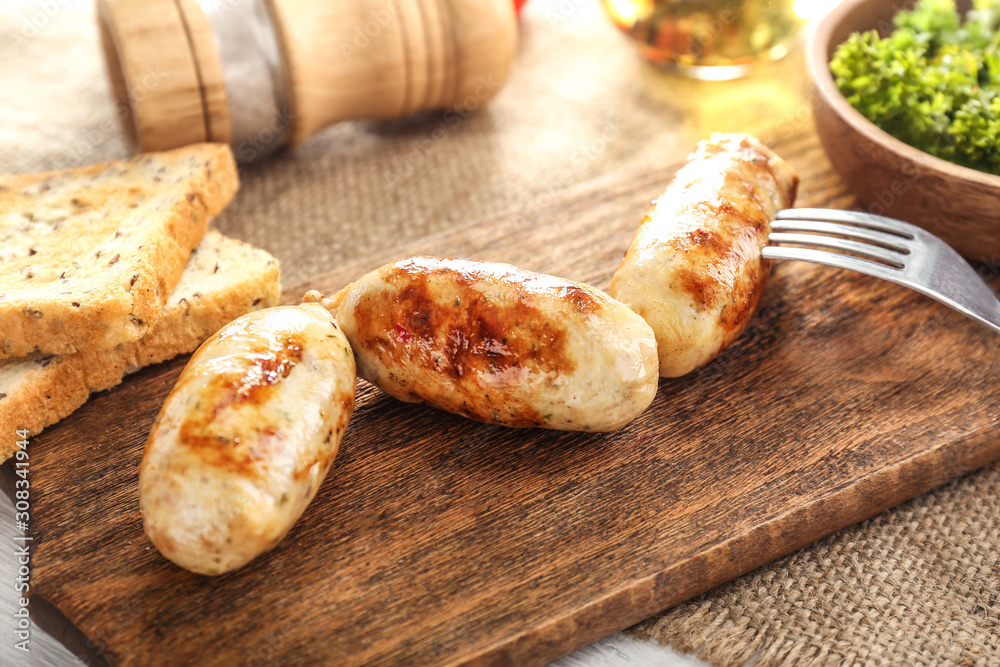 Tasty grilled sausages wooden board