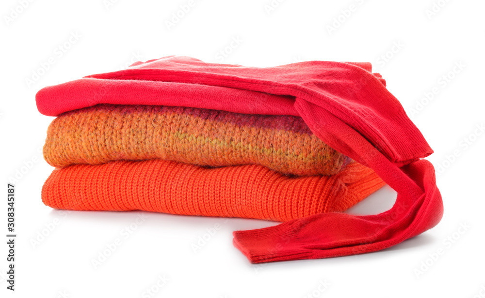 Stack of clean clothes on white background