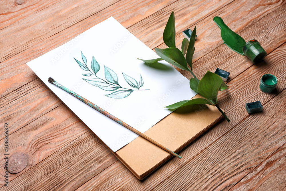 Artists painting of plant on wooden background