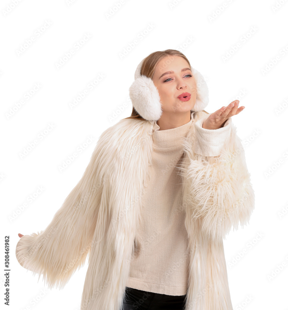 Beautiful woman in winter clothes on white background