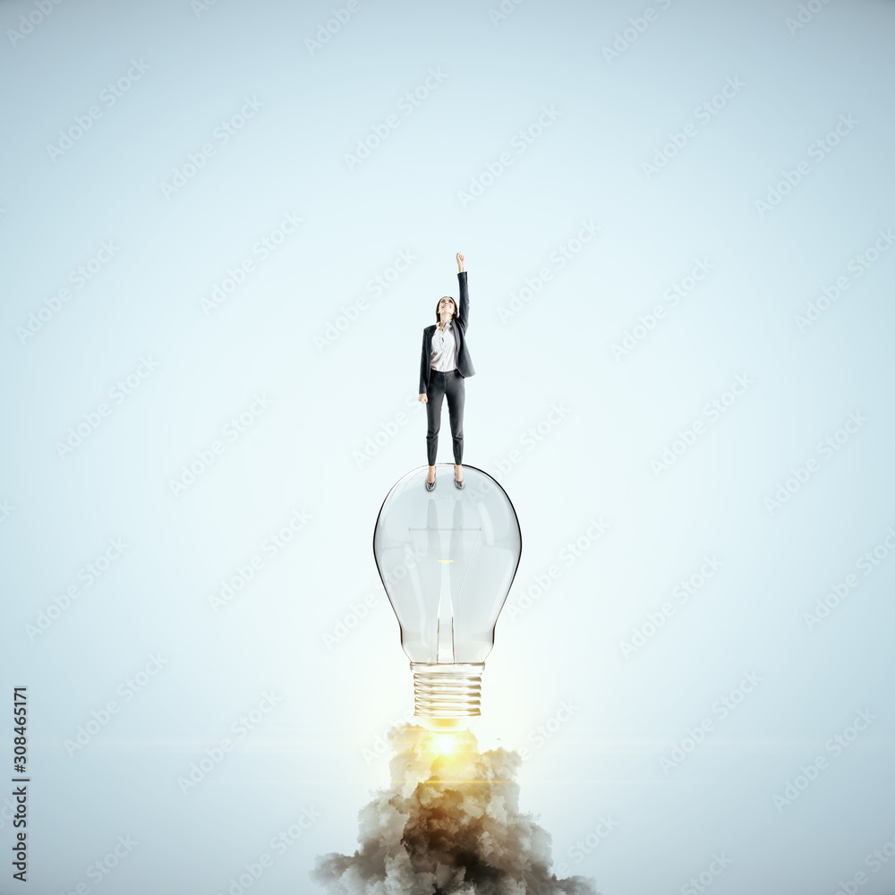 Businesswoman flying with launching lamp