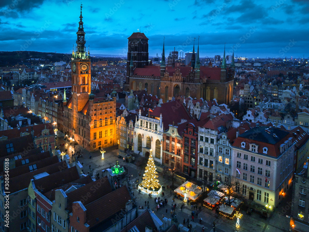 Aerial view of the old town in Gdansk with beautiful christmas tree at dusk, Poland