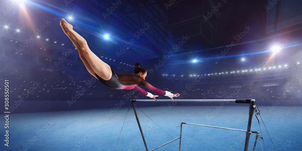 Female gymnast on professional arena.