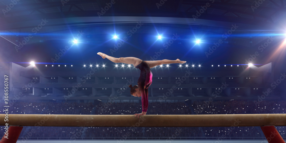 Female gymnast on professional arena.