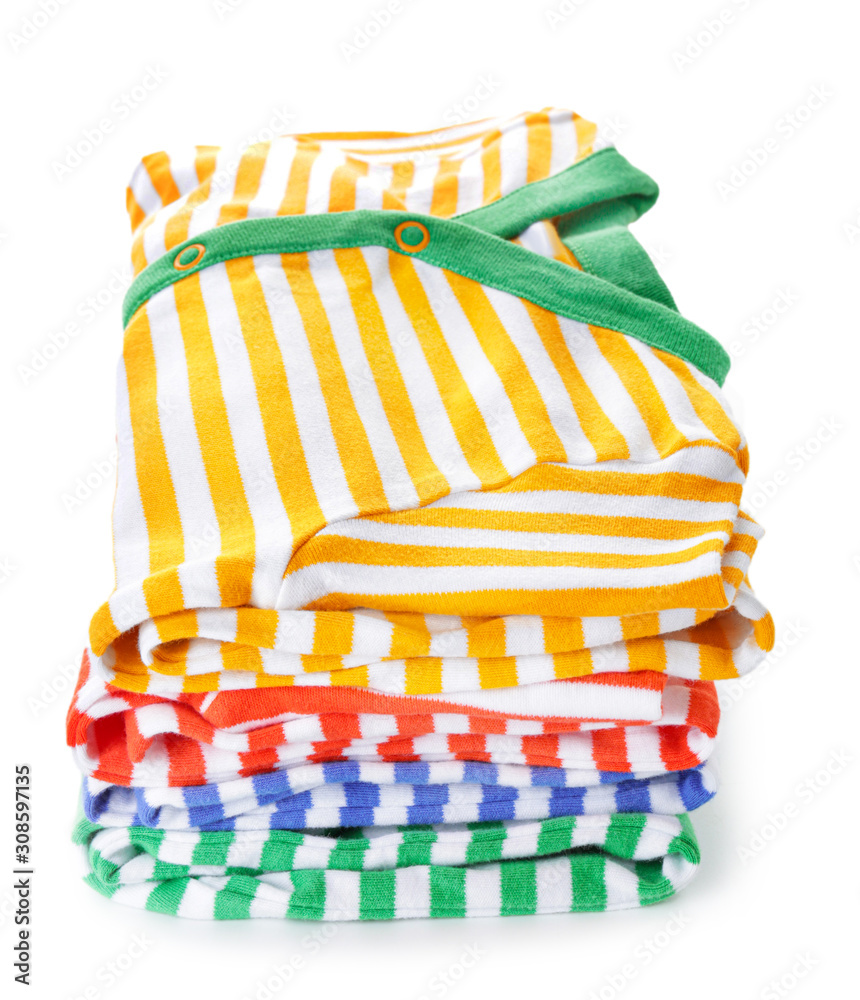 Stack of clean kid clothes on white background