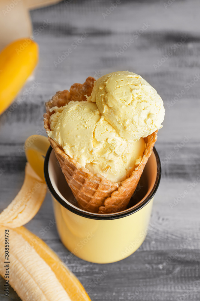 Sweet tasty banana ice-cream on table