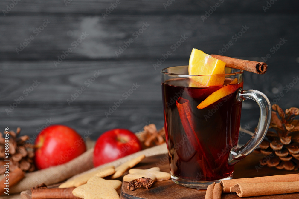 Cup of tasty mulled wine on table