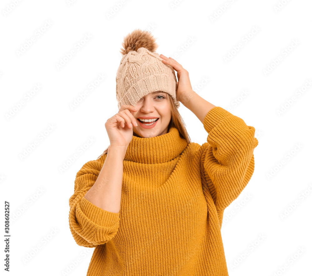 Beautiful woman in winter clothes on white background