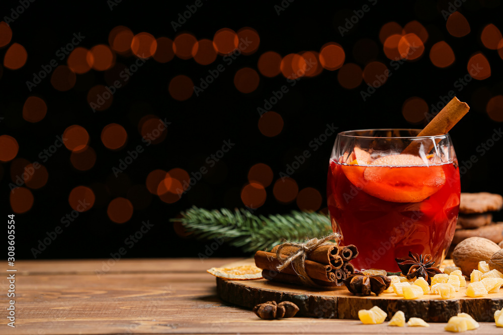 Glass of tasty mulled wine on table