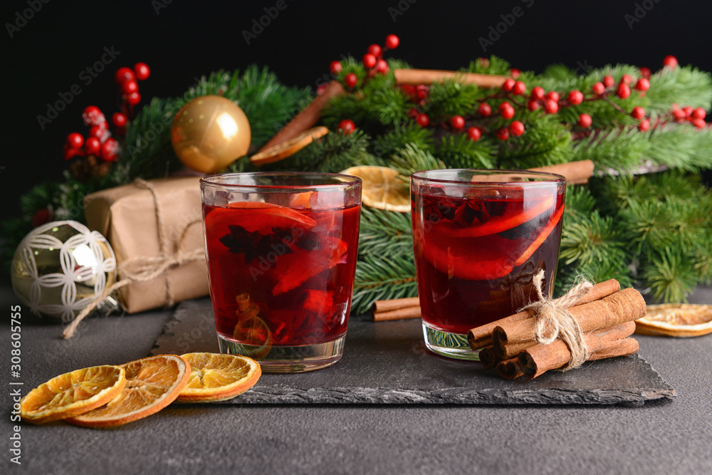 Christmas composition with tasty mulled wine on dark background