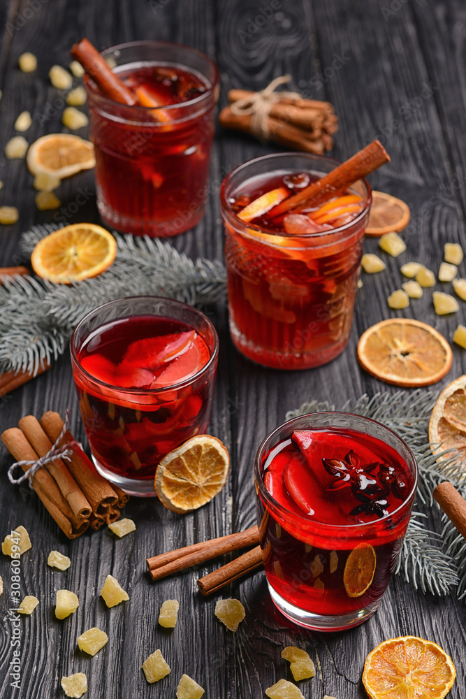 Christmas composition with tasty mulled wine on dark background