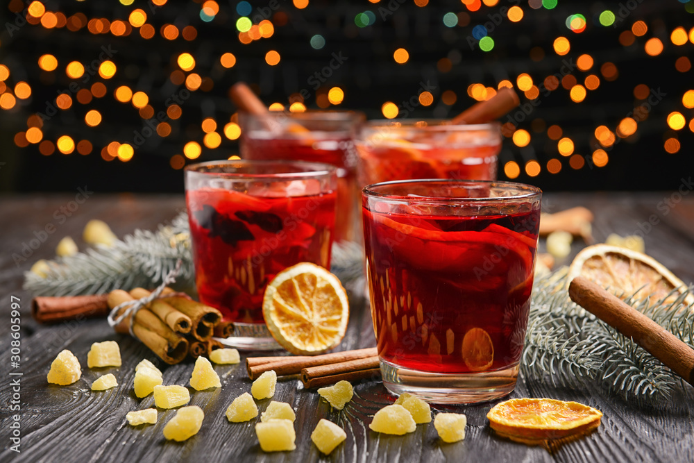 Christmas composition with tasty mulled wine on dark background