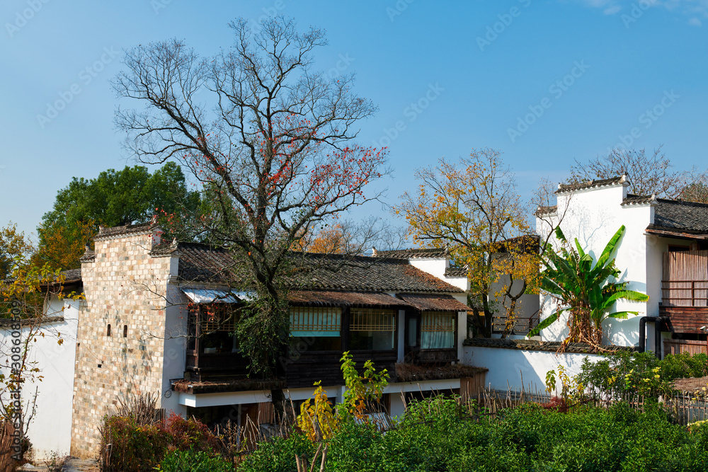 Hui-style architectures in fall forest on the hillside of China.