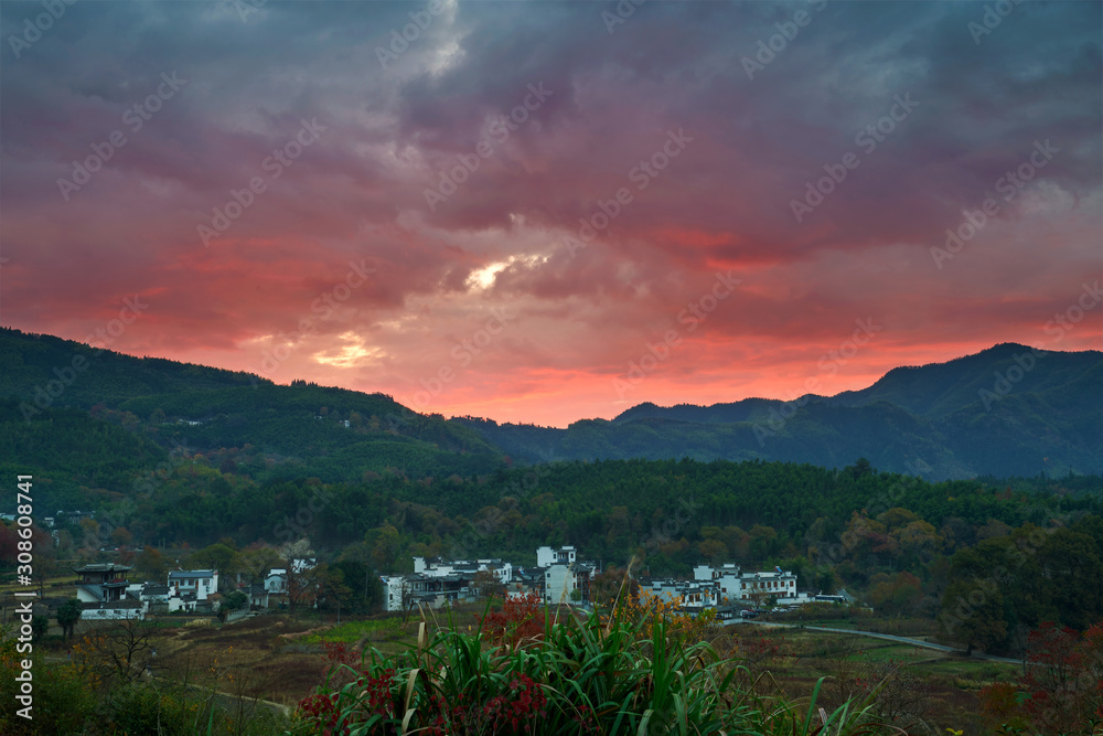 The beautiful cloudscape up the village and mountains sunrise.