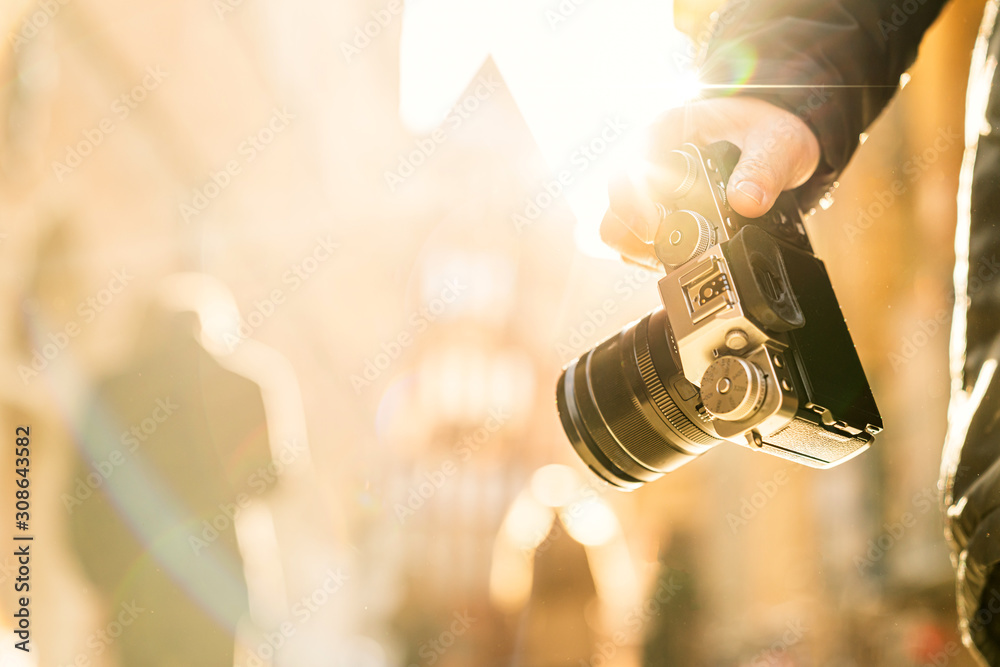 closeup asian woman hand hold retro camera traveller with background of old tradition architecture,a