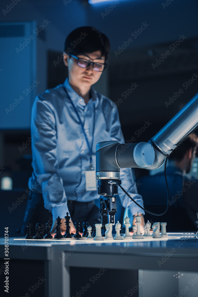 Vertical Shot of a Professional Japanese Development Engineer Testing an Artificial Intelligence Int