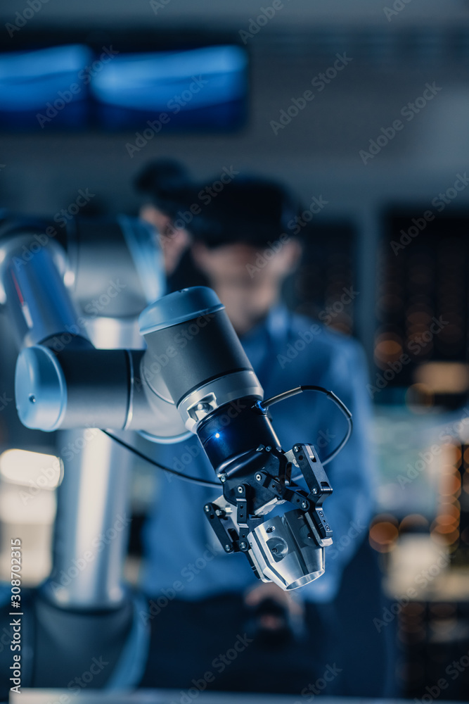 Vertical Close-up Shot of a Futuristic Robotic Arm Controlled by Professional Development Engineer w